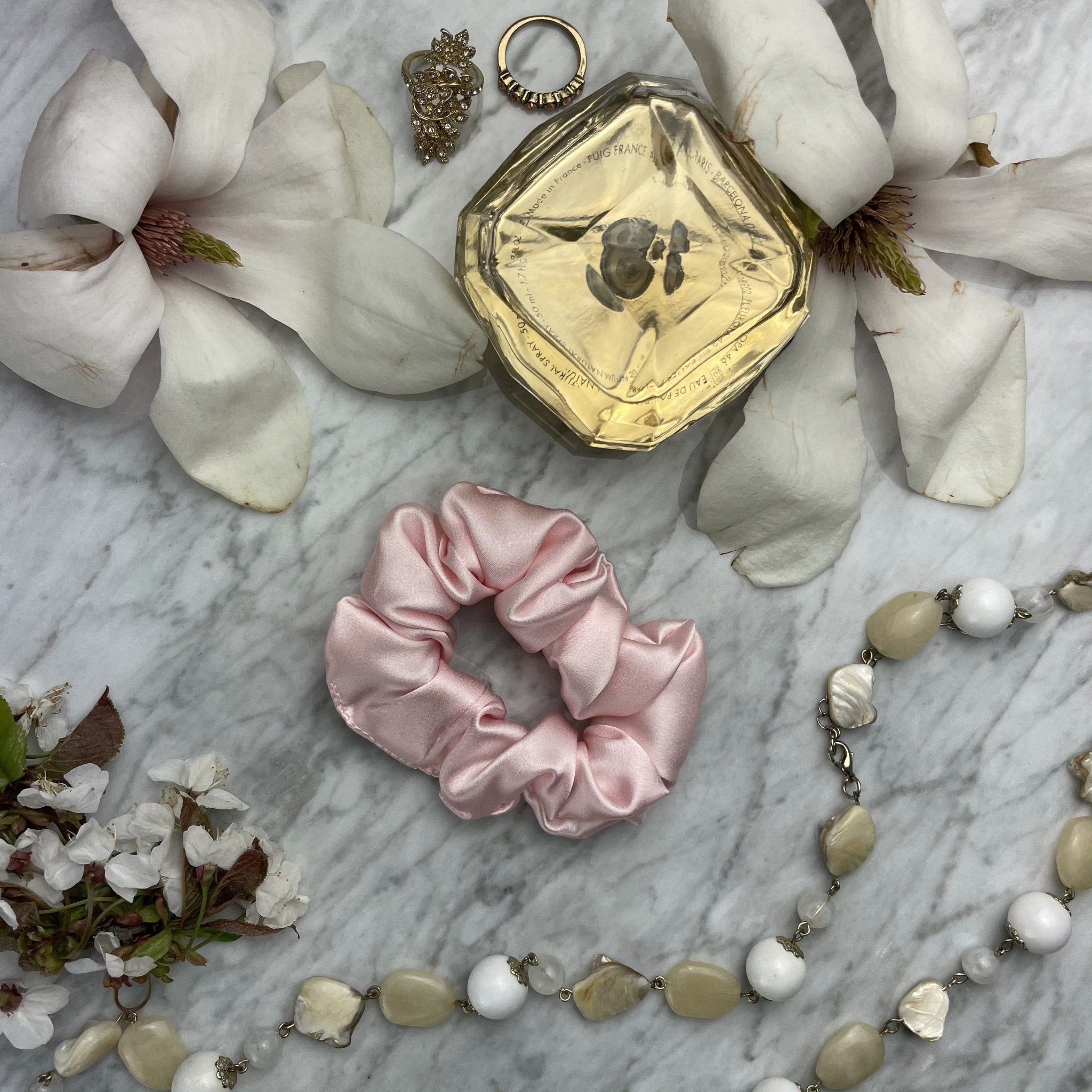 Pink silk scrunchie from DREAMSILK, regular size, soft and shiny satin fabric, perfect for hair accessories.