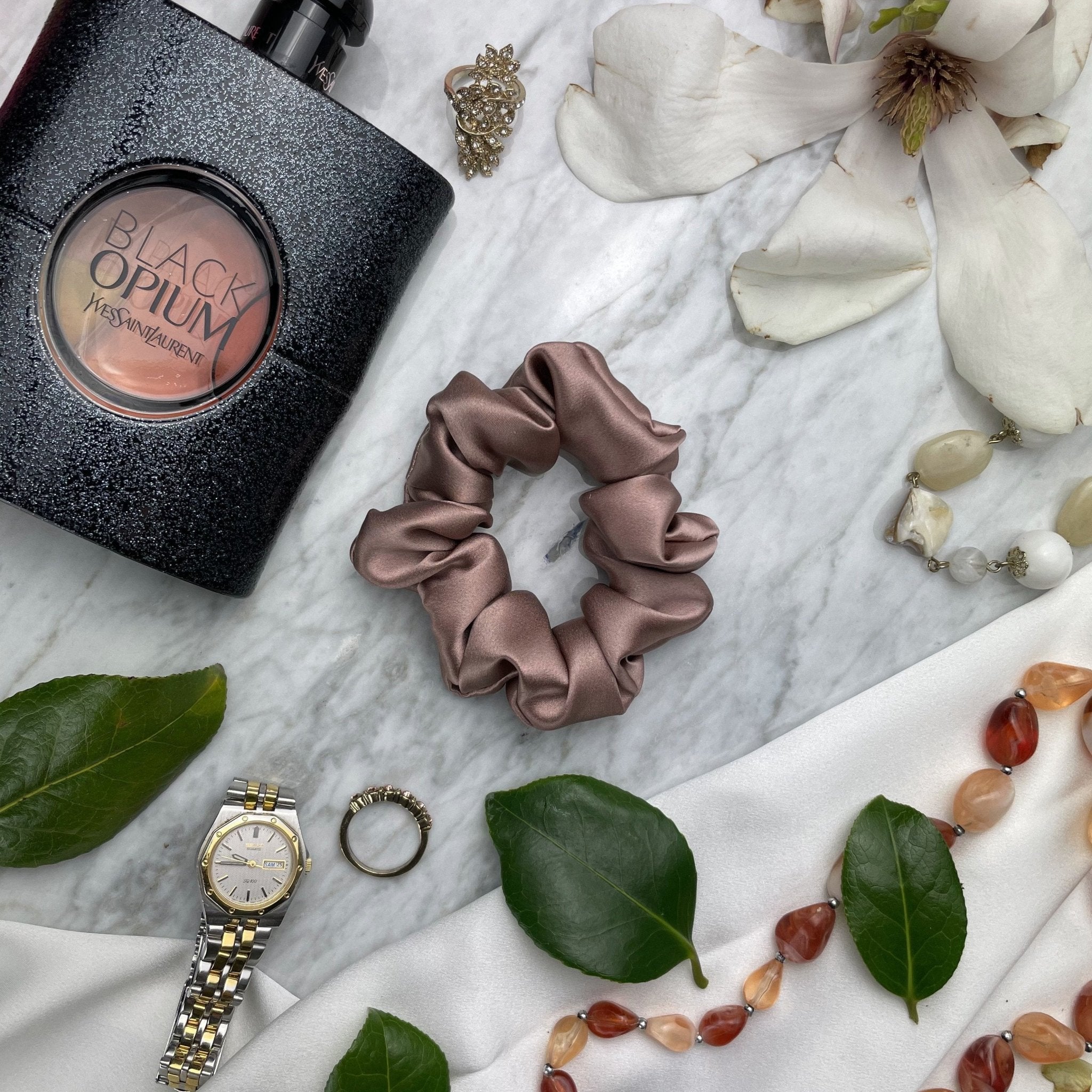 DREAMSILK bronze silk scrunchie in regular size, showcasing a smooth, shiny silk fabric with an elastic band for gentle hair hold.