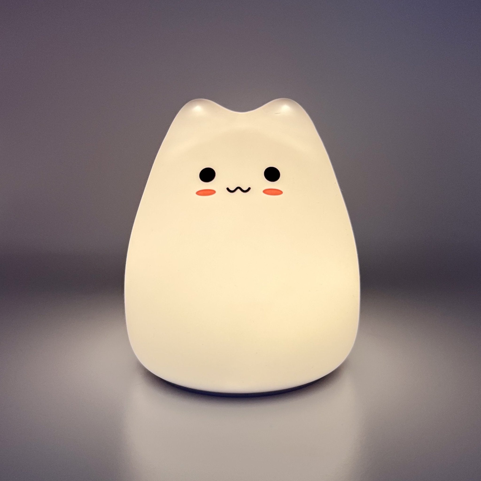 HikeWare silicone cat-shaped night light lamp glowing softly, ideal for cozy bedroom or nursery lighting.