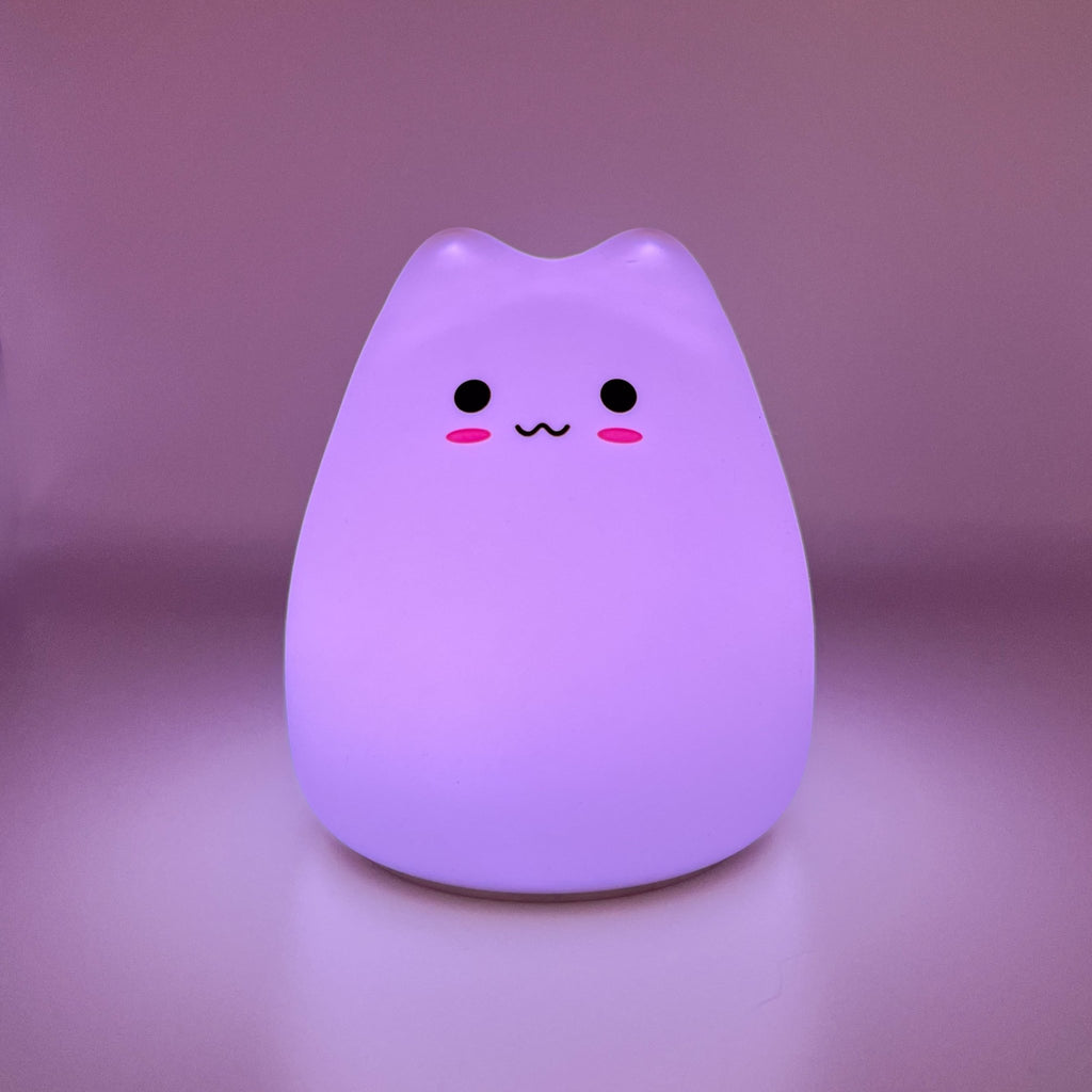 HikeWare silicone cat-shaped night light lamp illuminating softly, designed as a cute and cozy night light for children and cat lovers.