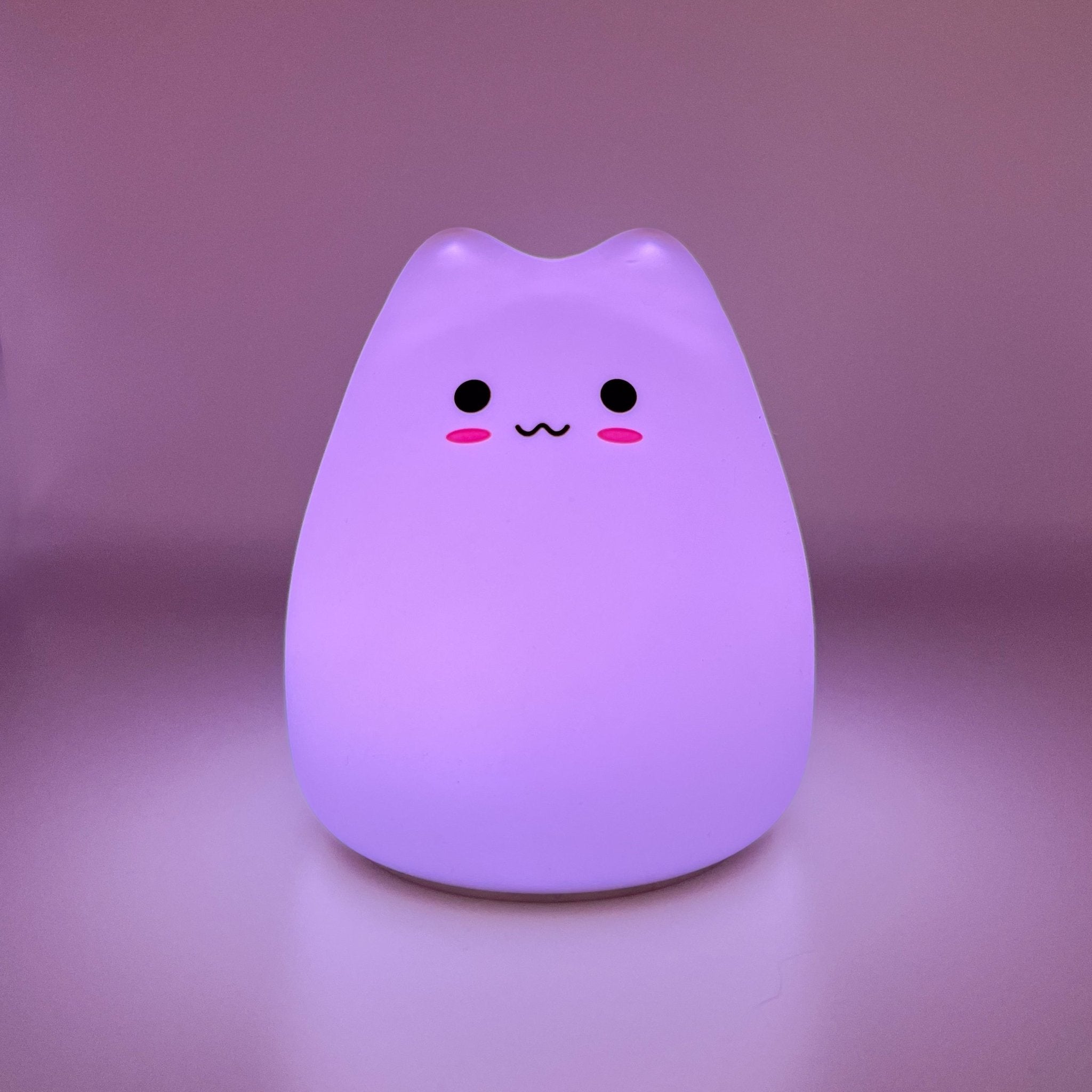 HikeWare silicone cat-shaped night light lamp illuminating softly, designed as a cute and cozy night light for children and cat lovers.