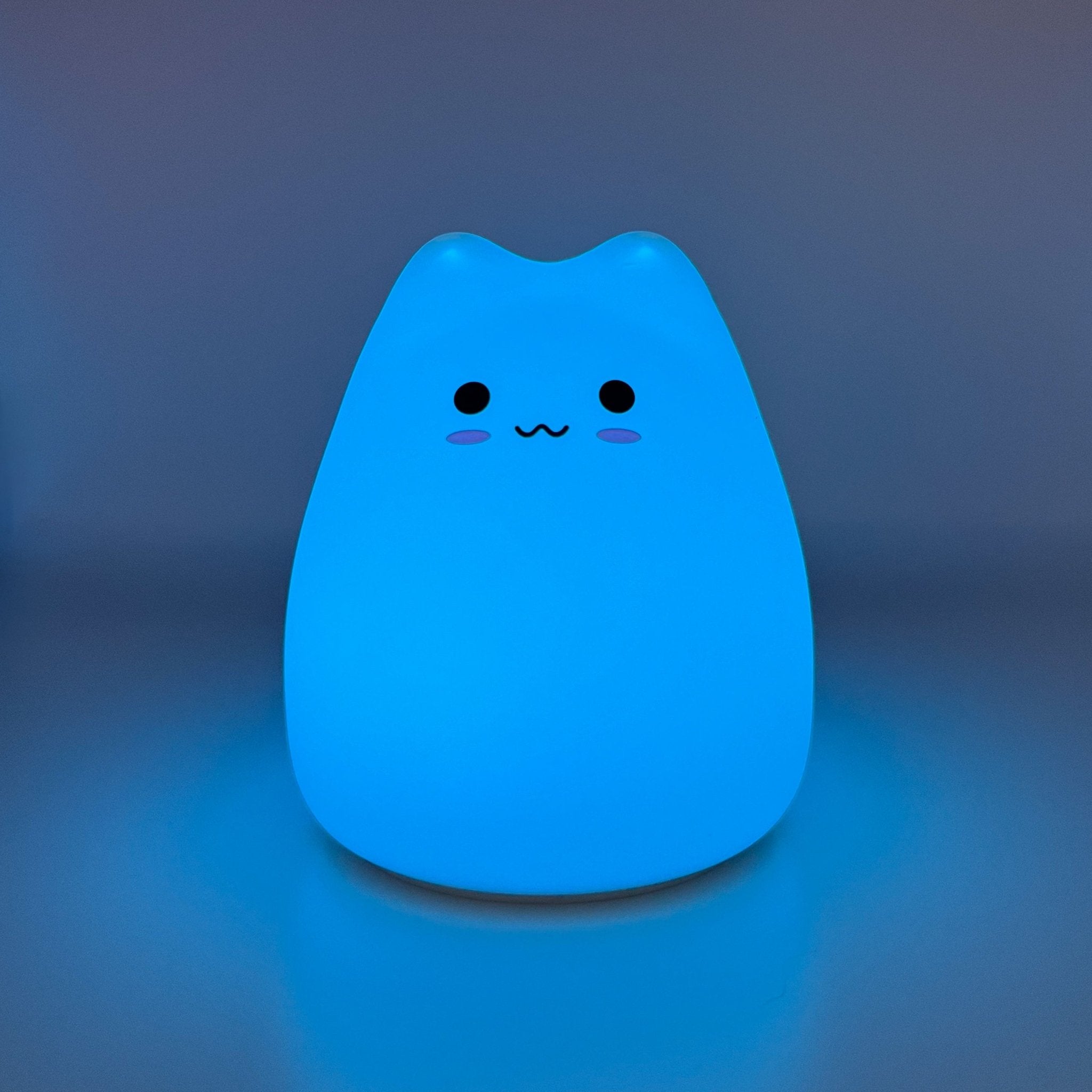 HikeWare silicone cat-shaped night light lamp illuminating softly, ideal for cozy bedrooms or children's rooms.