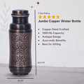Pure copper jumbo water bottle with black antique engraving by SAMA Homes, handcrafted for sustainable Ayurvedic hydration.
