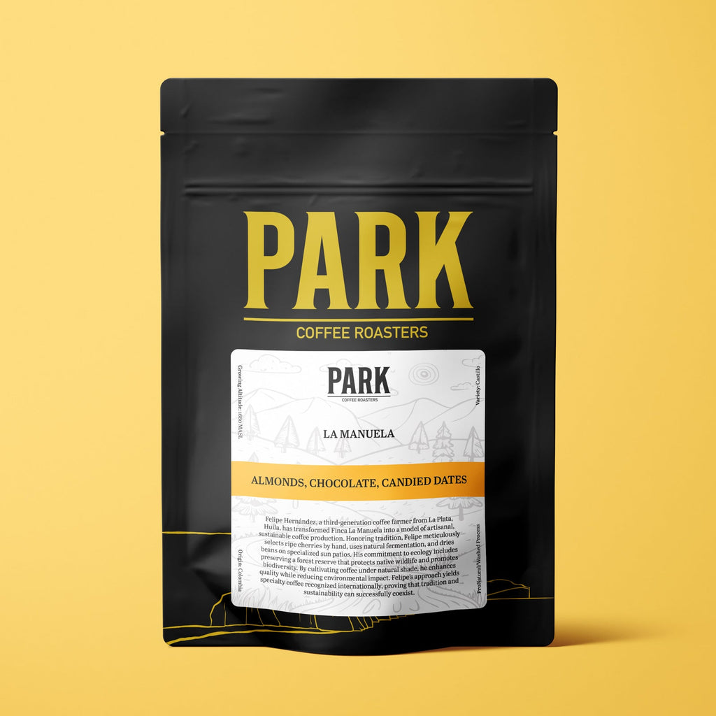 Roasted Colombia La Manuela coffee beans from Park Coffee, showcasing the rich, dark roasted coffee product with a glossy surface.