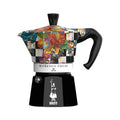Bialetti Moka Express coffee maker with Mackenzie Childs design, Brew Italia branding, featuring a patterned ceramic body and stainless steel handle.