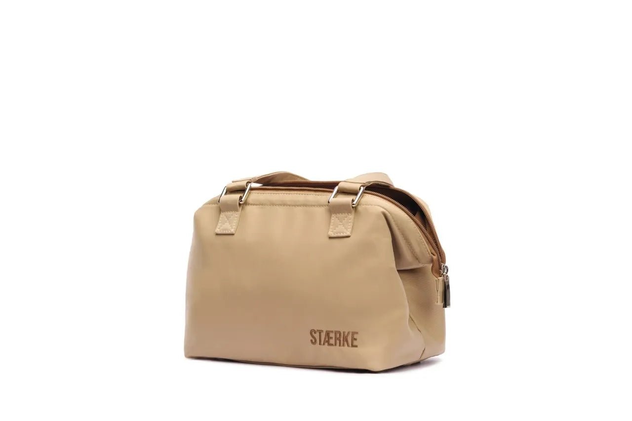 STÆRKE Mini In-Gym Bag with black straps and compact design, perfect for carrying gym essentials.