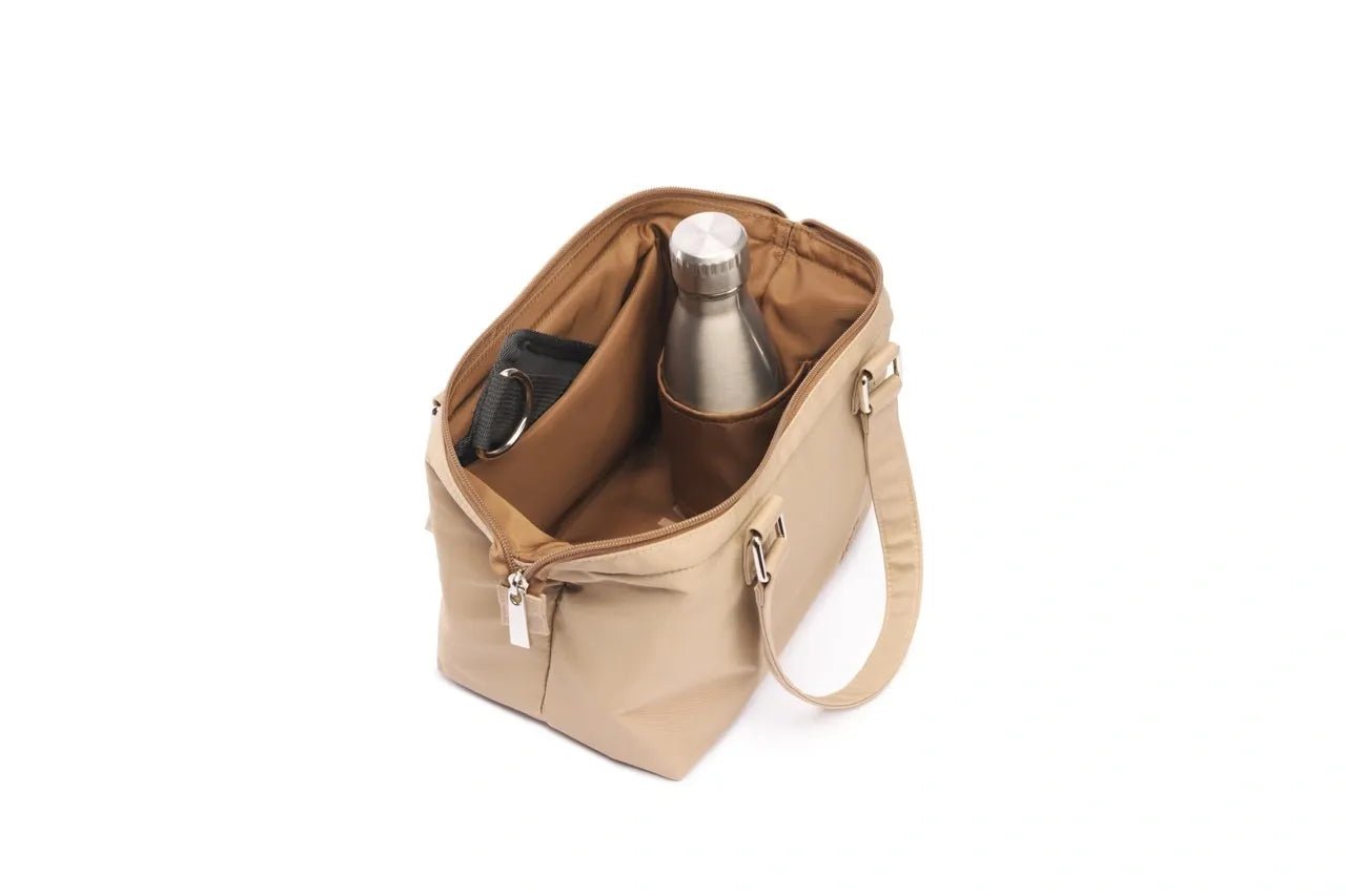 STÆRKE Mini In-Gym Bag showing compact navy gym bag with shoulder strap and zippered compartments.