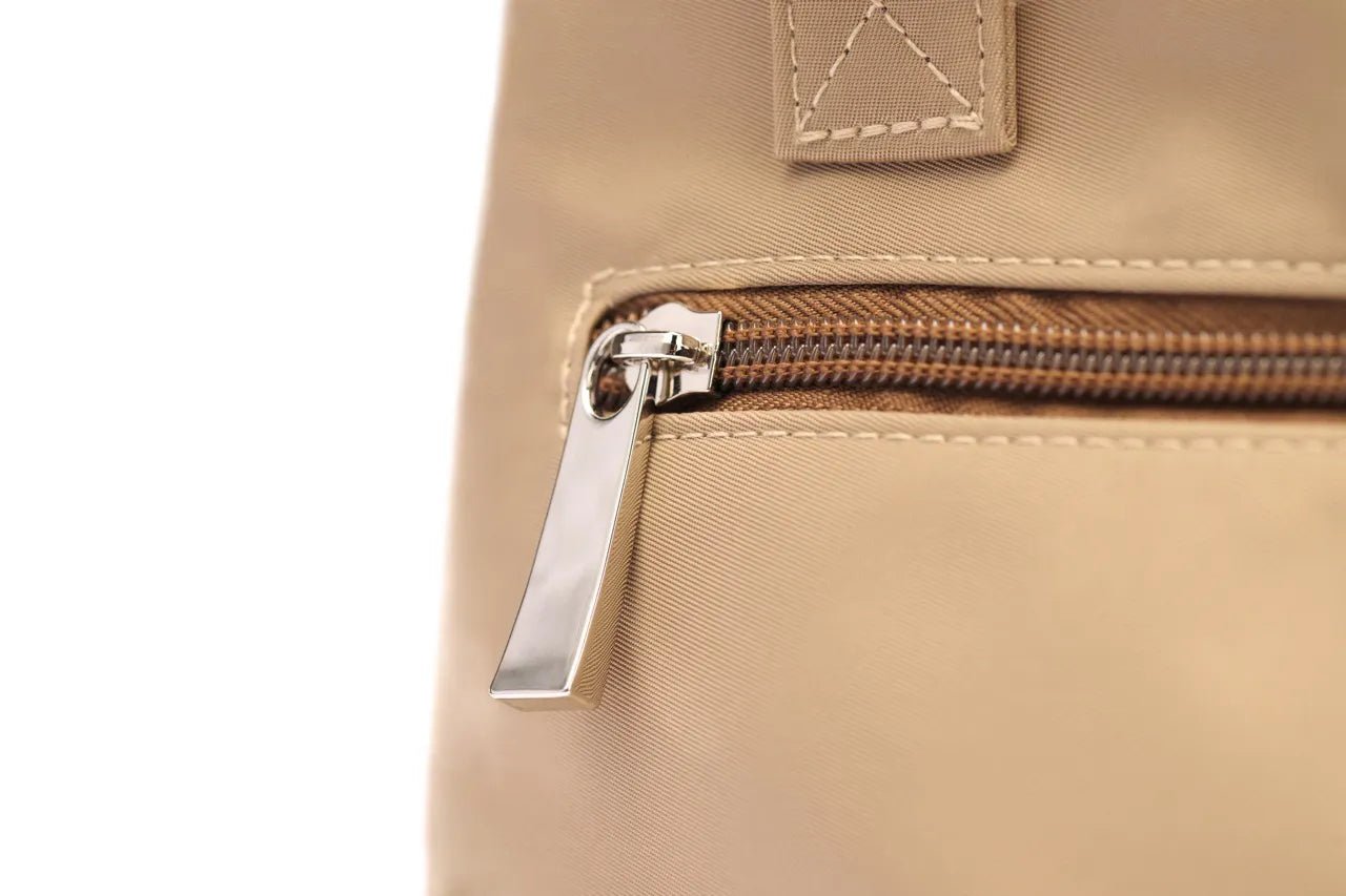 Small STÆRKE Mini In-Gym Bag with adjustable straps and multiple compartments, ideal for carrying gym essentials.