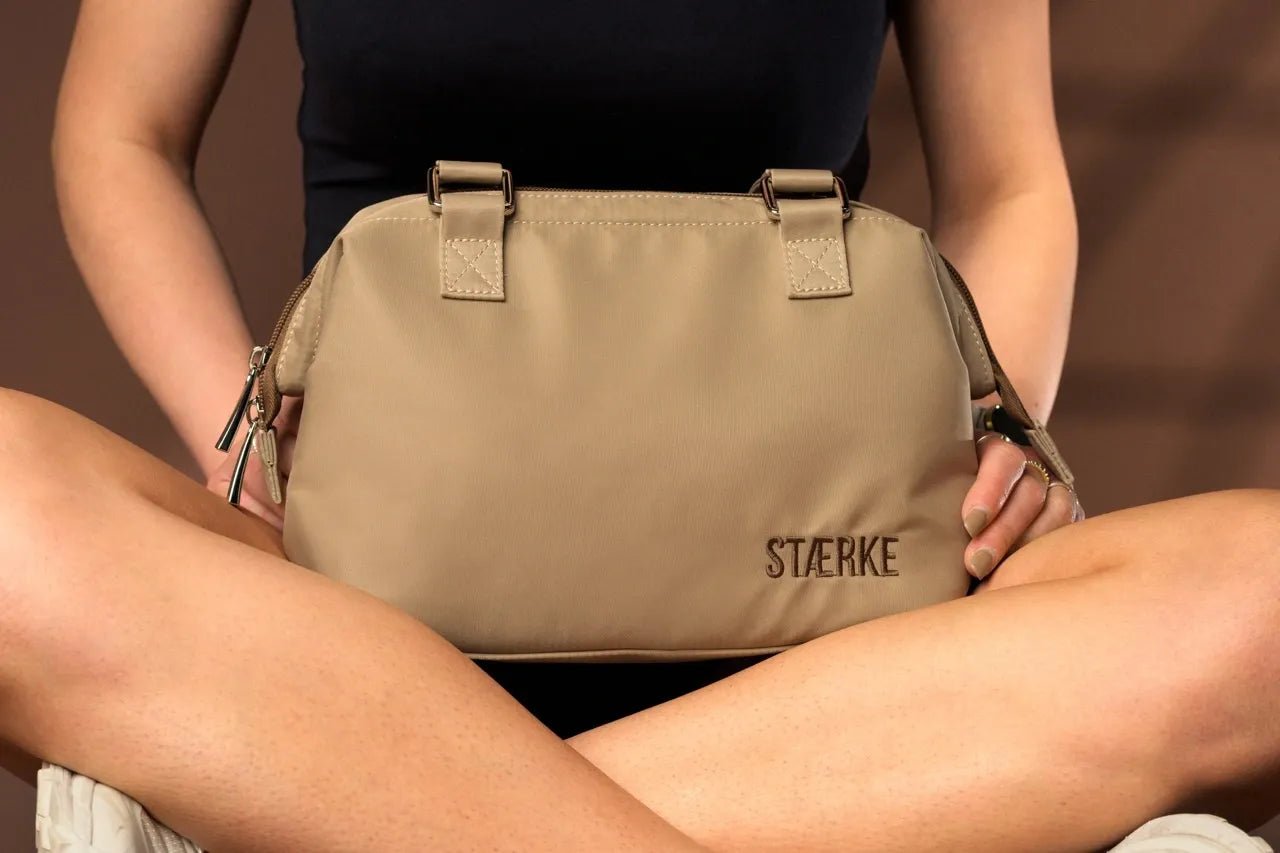 Mini gym bag by STÆRKE featuring a compact design and sturdy handles, perfect for carrying workout essentials.