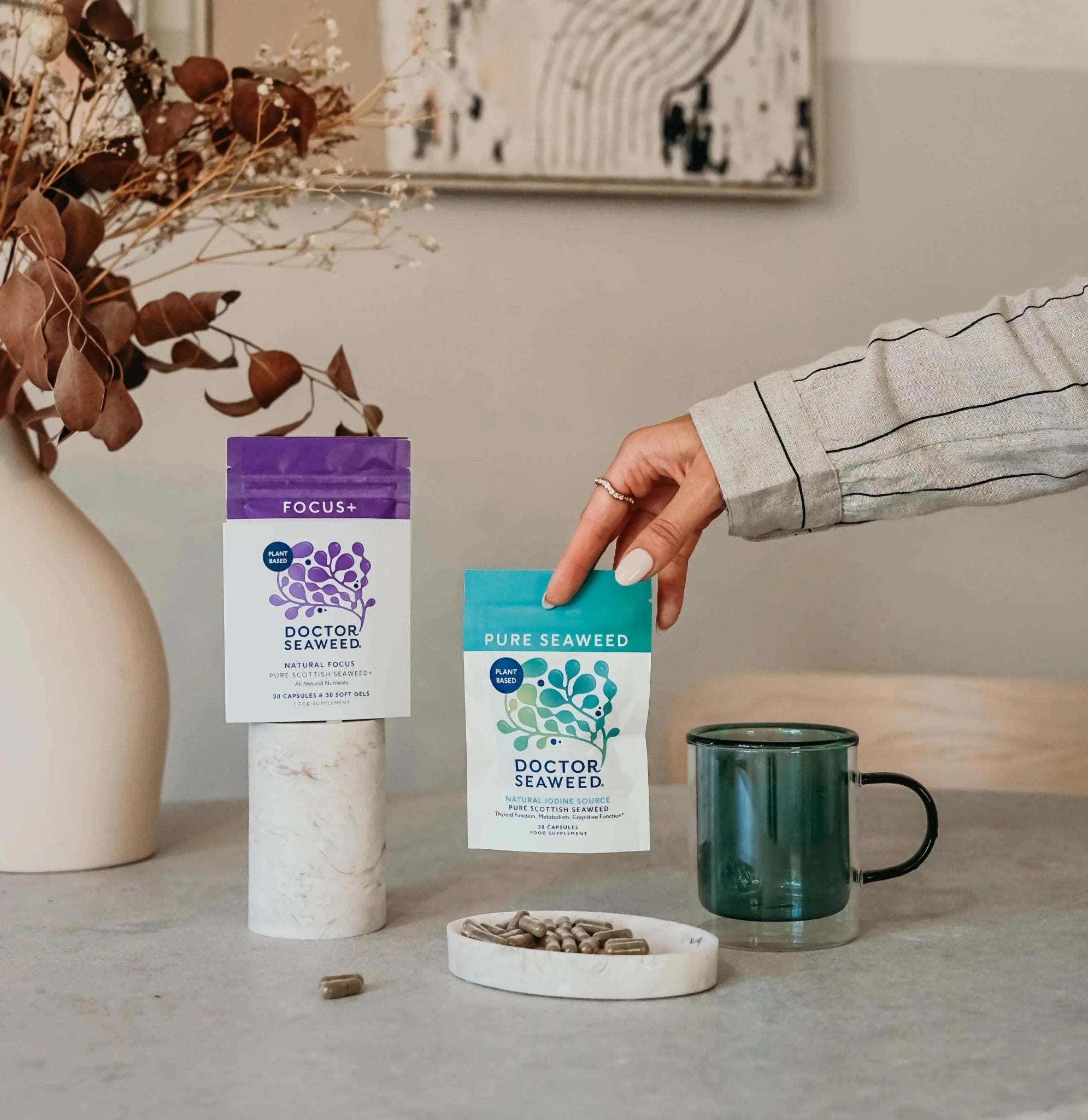 Doctor Seaweed Mental Resilience Duo package with supplement bottles and a person practicing mindfulness in a serene setting.