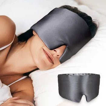 Black silk sleep mask by DREAMSILK with soft padding, blocking light for restful sleep and eye comfort.
