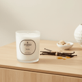 Parks Candles vanilla scented candle in a 180g glass jar, with a lit wick and warm vanilla aroma.
