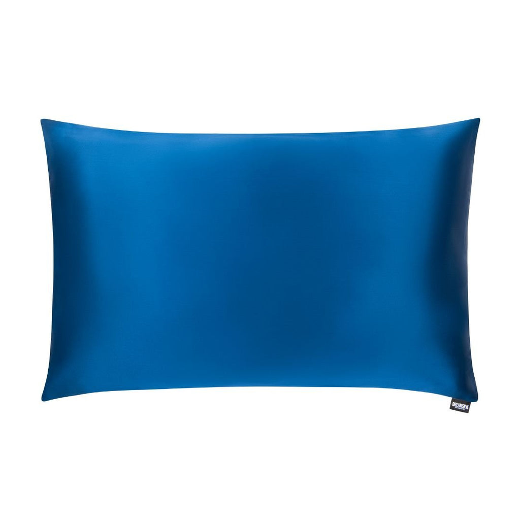 Navy blue silk pillowcase from DREAMSILK, standard size, smooth and luxurious fabric, close-up of the silky texture.