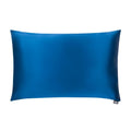 Navy blue silk pillowcase from DREAMSILK, standard size, smooth and luxurious fabric, close-up of the silky texture.