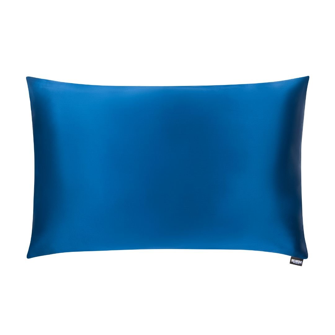 Navy blue silk pillowcase from DREAMSILK, standard size, smooth and luxurious fabric, close-up of the silky texture.