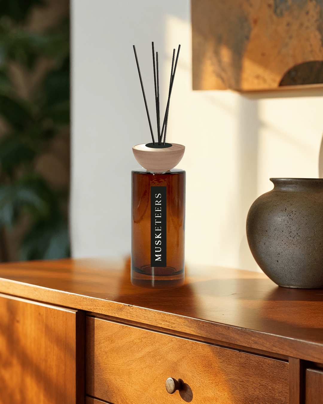 Musketeers Ocean Reed Diffuser with a sleek glass bottle and natural reed sticks, designed for fresh coastal home fragrance.