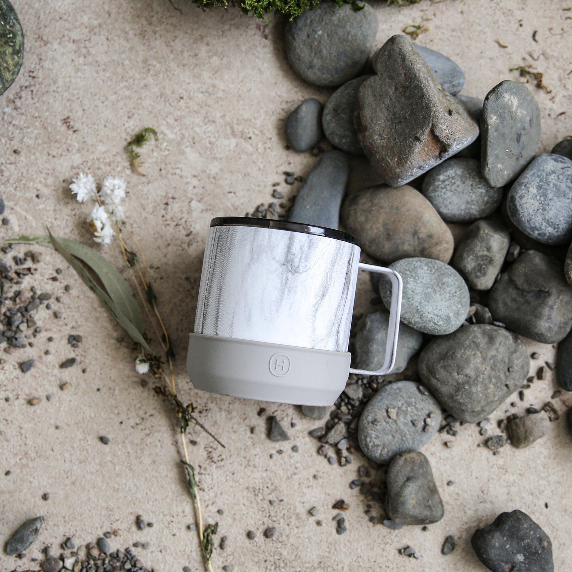 White marble camp mug by HYDY with eucalyptus design, 10 oz ceramic outdoor cup for camping and outdoor use.