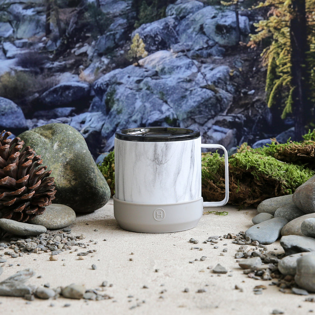 White marble HYDY camp mug with eucalyptus design, 10 oz size, sturdy ceramic material, ideal for outdoor camping and travel.