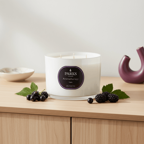 Parks Candles Cassis 3-wick 350g scented candle with purple wax and glass jar, showcasing the elegant candle design.