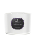 Parks Candles Cassis 3-wick candle in 350g glass jar with a floral purple and white label and three burning wicks.
