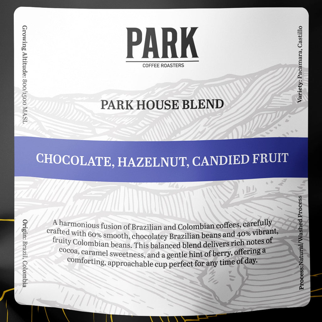 Close-up of Park House Blend roasted coffee beans by Park Coffee, showcasing rich, dark roasted coffee in a natural setting.