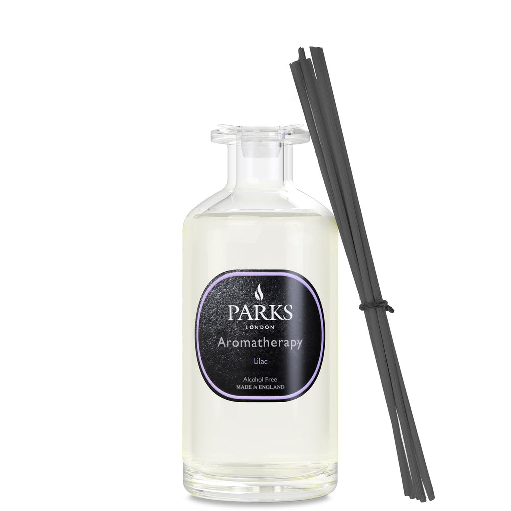 Lilac reed diffuser by Parks Candles in a 220ml glass bottle with natural reed sticks for home aromatherapy.