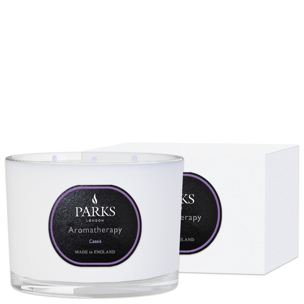 Parks Candles Cassis 3-wick scented candle in a 350g glass jar, featuring a rich cassis fruit fragrance and warm candlelight.
