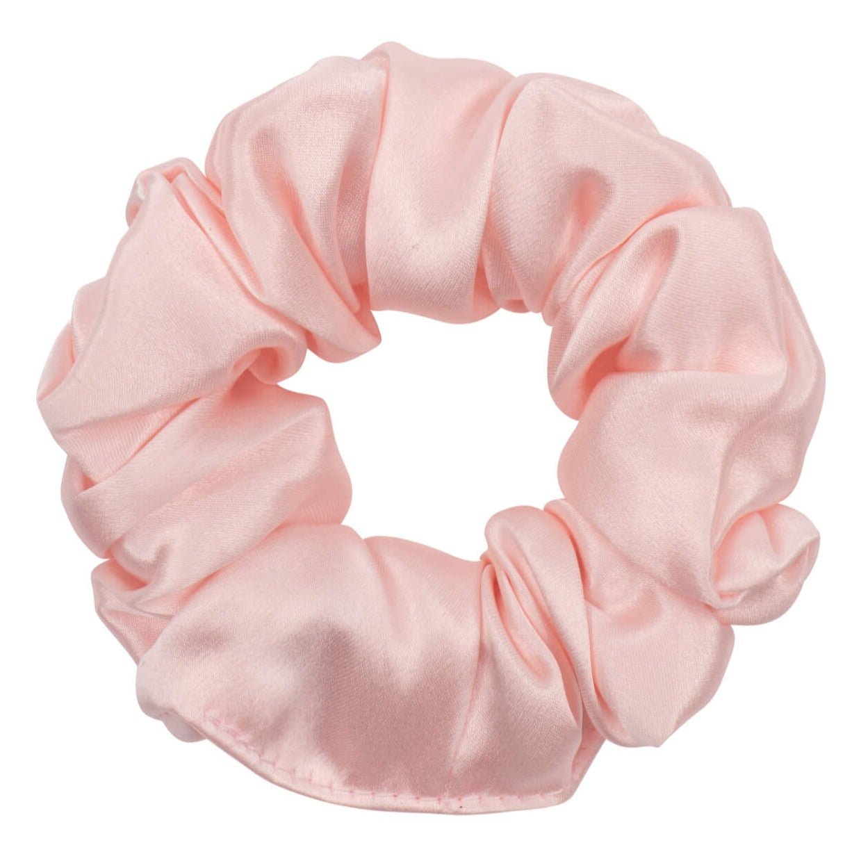 Pink silk scrunchie from DREAMSILK with a smooth, shiny fabric and elastic band for gentle hair styling.