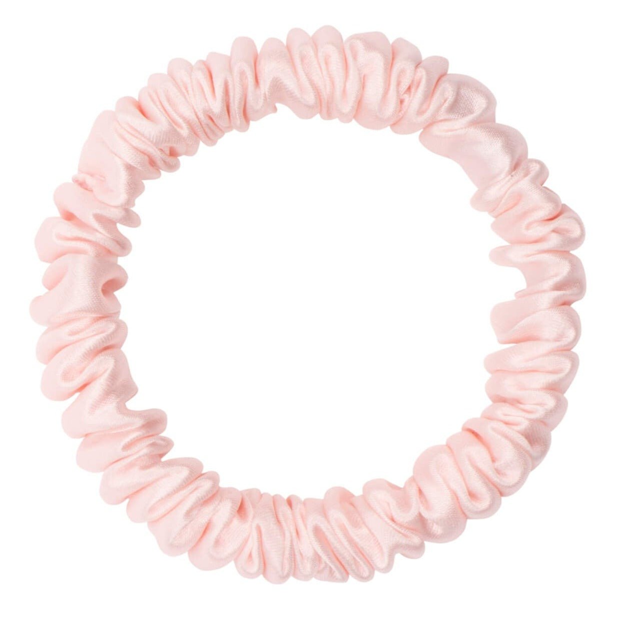Pink silk skinny scrunchie by DREAMSILK, soft and smooth hair accessory with a sleek, slender design for gentle hold.