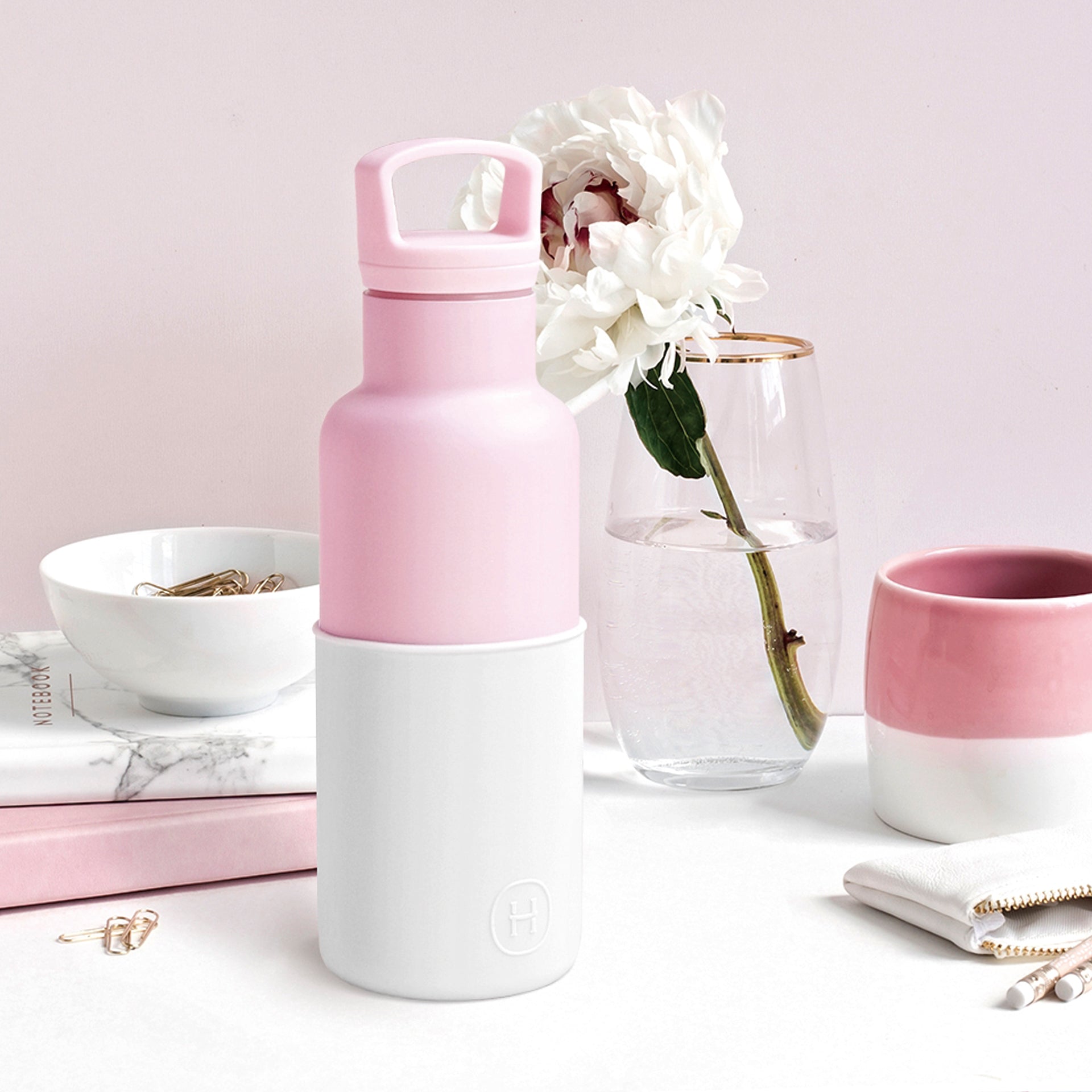 HYDY Rose Pink-Snow 16 Oz water bottle with a white design, featuring a sleek shape and secure lid for on-the-go hydration.