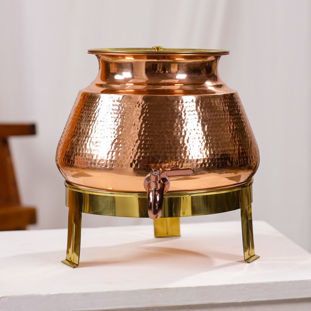 Handcrafted 8L pure copper water dispenser with hammered finish and tap, designed by SAMA Homes for Ayurvedic water storage.