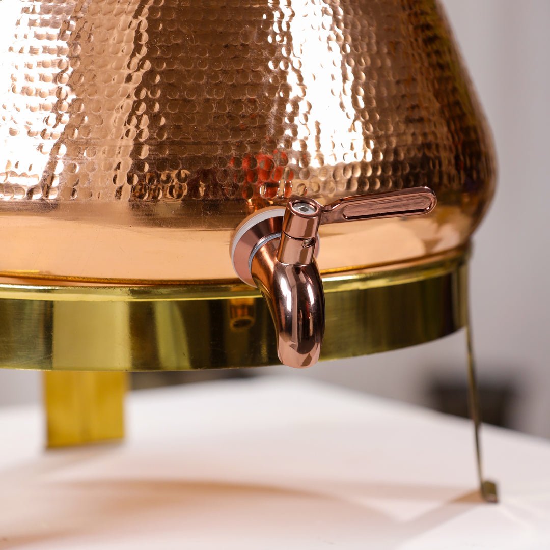 Hammered 8L pure copper water dispenser with tap by SAMA Homes, handcrafted Ayurvedic-style copper pot for water storage.