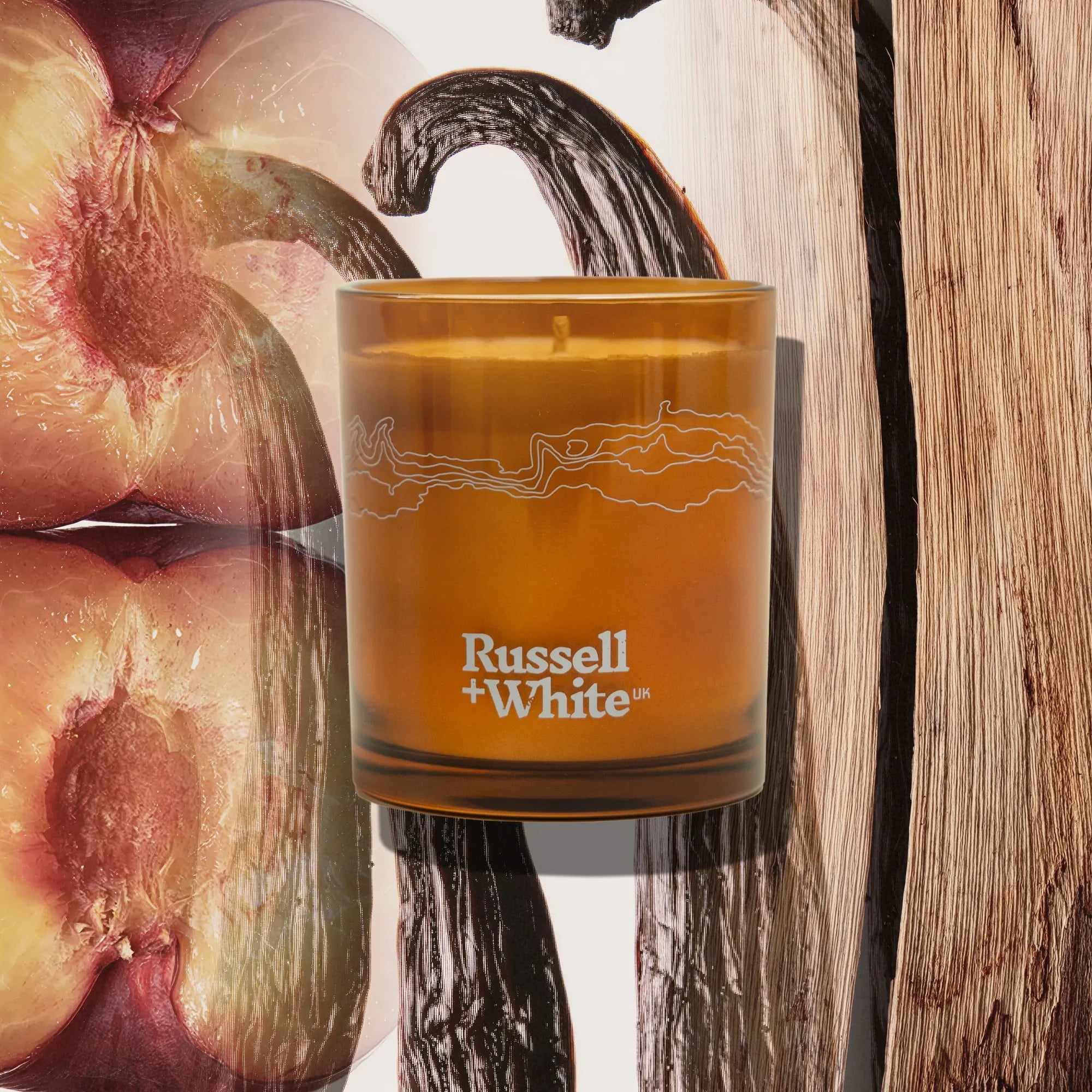 Russell + White San Marco scented soy candle in a glass jar with a burning wick and a warm, inviting glow.