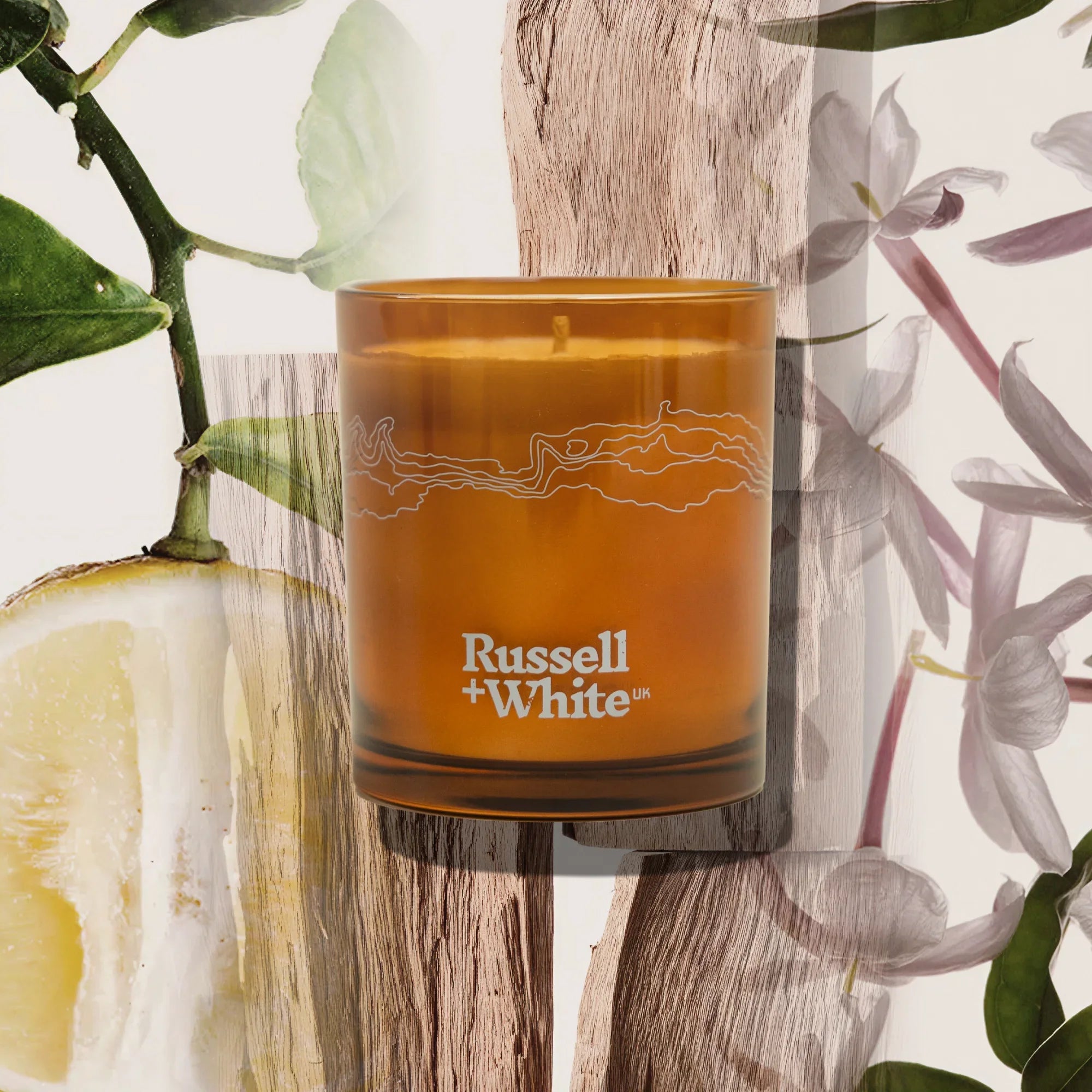 Russell + White Sugi scented soy candle in a glass jar with a natural wax finish, ideal for creating a calming atmosphere