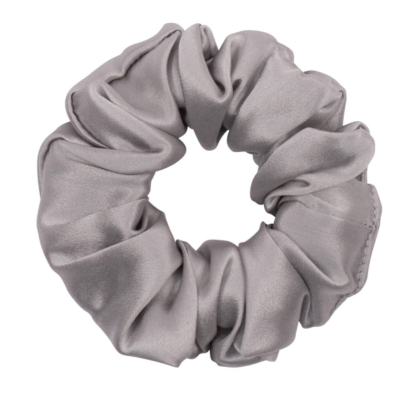 Silver silk scrunchie from DREAMSILK, showcasing a soft, shiny fabric hair accessory on a plain background.