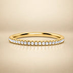 Vianne Jewellery thin full eternity ring in 18k gold vermeil, 1.2 mm wide, with a continuous row of small sparkling gemstones.