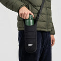Black ION8 lightweight sling bottle bag with adjustable strap and compact design for carrying beverages on the go.