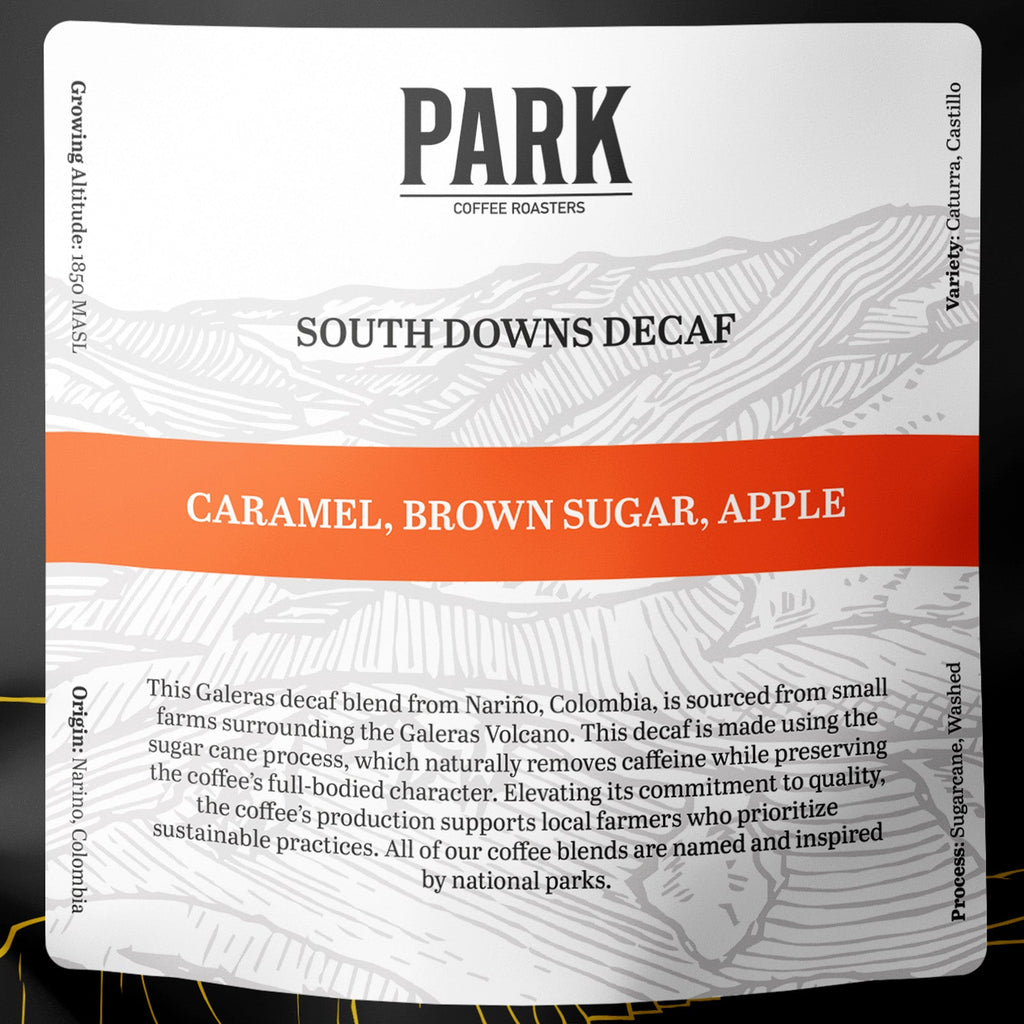 Close-up of Park Coffee South Downs Decaf Blend roasted coffee beans showing rich brown color and textured surface.