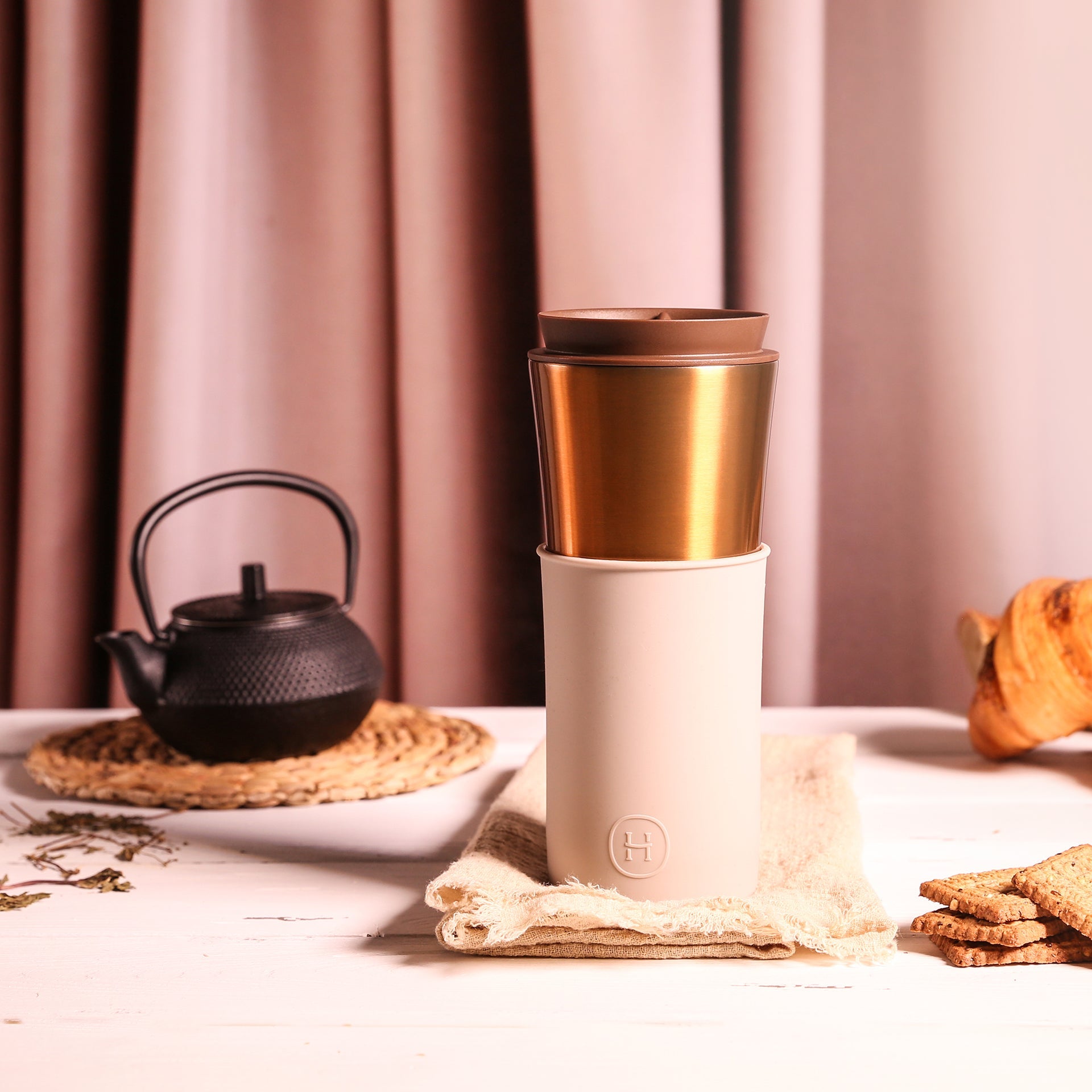 Bronze gold travel mug with eucalyptus design by HYDY, 15 oz stainless steel insulated travel mug for hot and cold beverages.