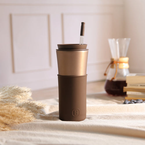 HYDY Cedar Travel Mug in mocha color, 15 oz, with a sleek design and lid, ideal for hot beverages on the go.
