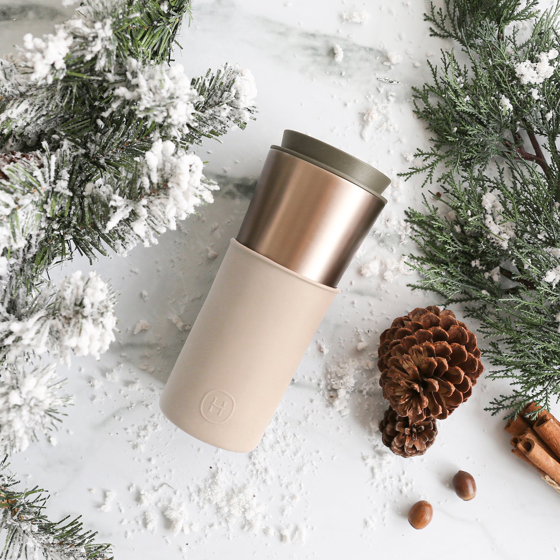 Metallic eucalyptus-colored HYDY travel mug, 15 oz, with a sleek metallic finish and ergonomic handle for hot beverages.