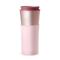 Pink travel mug with cherry blossom design, 15 oz size by HYDY, featuring a floral pattern on a ceramic or stainless steel mug.