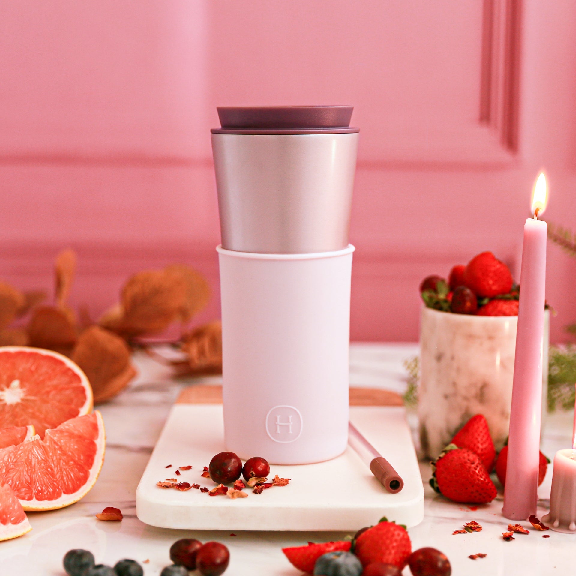Pink travel mug with cherry blossom design, 15 oz capacity, featuring the HYDY brand logo on a ceramic mug.