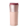 Pink pearl travel mug by HYDY, 15 oz latte-style ceramic mug with a lid and handle for hot beverages.