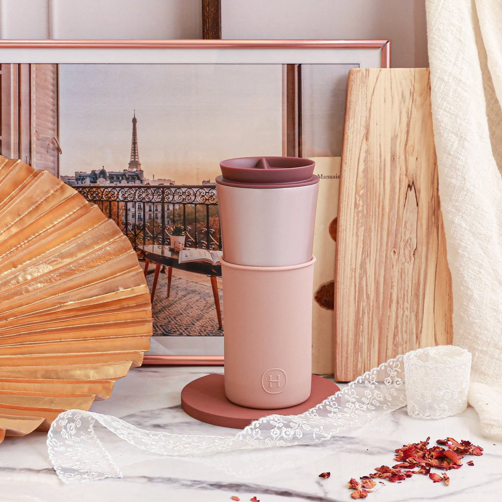 Pink pearl travel mug by HYDY, 15 oz latte style with a sleek design and durable handle, perfect for on-the-go coffee.