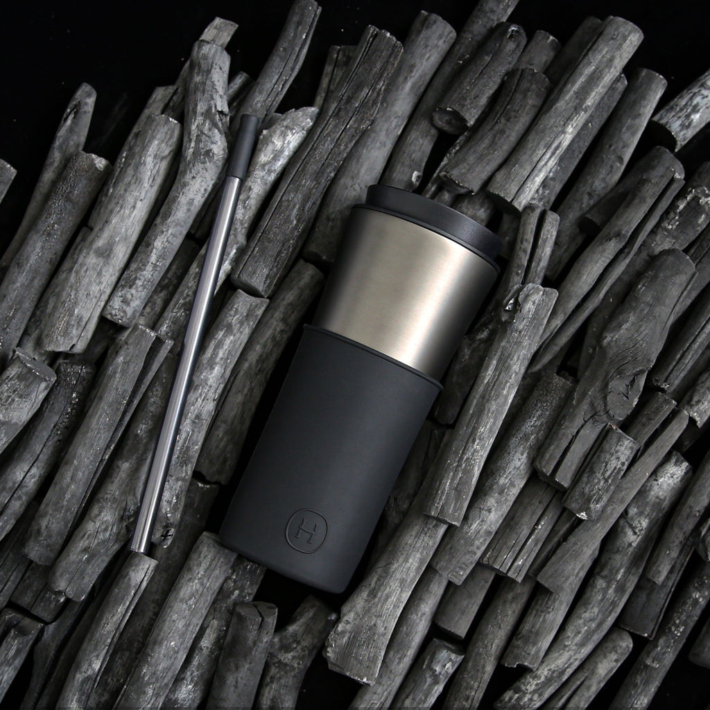 Titanium grey and black HYDY 15 oz travel mug with a sleek design, ideal for hot or cold beverages on the go.