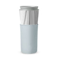 White marble HYDY Cumulus 15 oz travel mug with a sleek design, featuring a durable stainless steel body and spill-proof lid.
