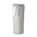 White marble HYDY travel mug with cloudy grey design, 15 oz capacity, featuring a sleek, modern ceramic and stainless steel construction.