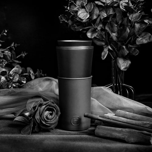 Black HYDY 15 oz travel mug with a sleek ink black finish, featuring a spill-proof lid and ergonomic design for on-the-go use.
