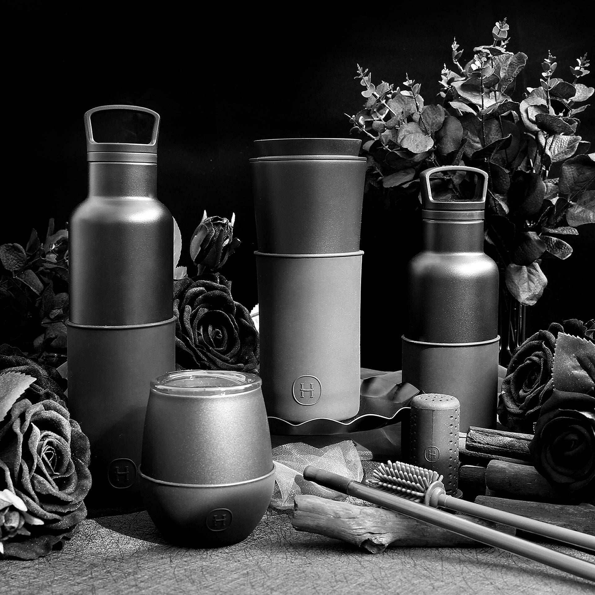 Black HYDY travel mug with 15 oz capacity, featuring a sleek ink black design and stainless steel body for hot and cold beverages.